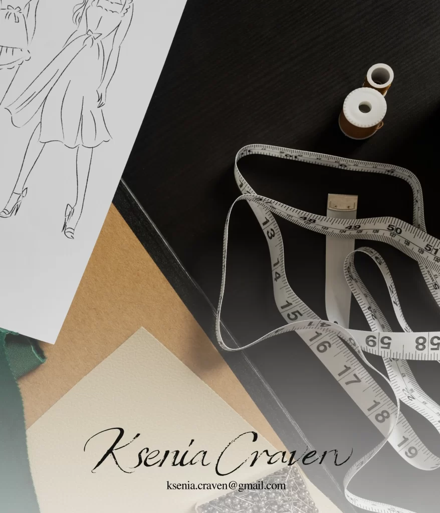Close-up of a fashion design sketch, tape measure, thread, and fabric on a dark desk.